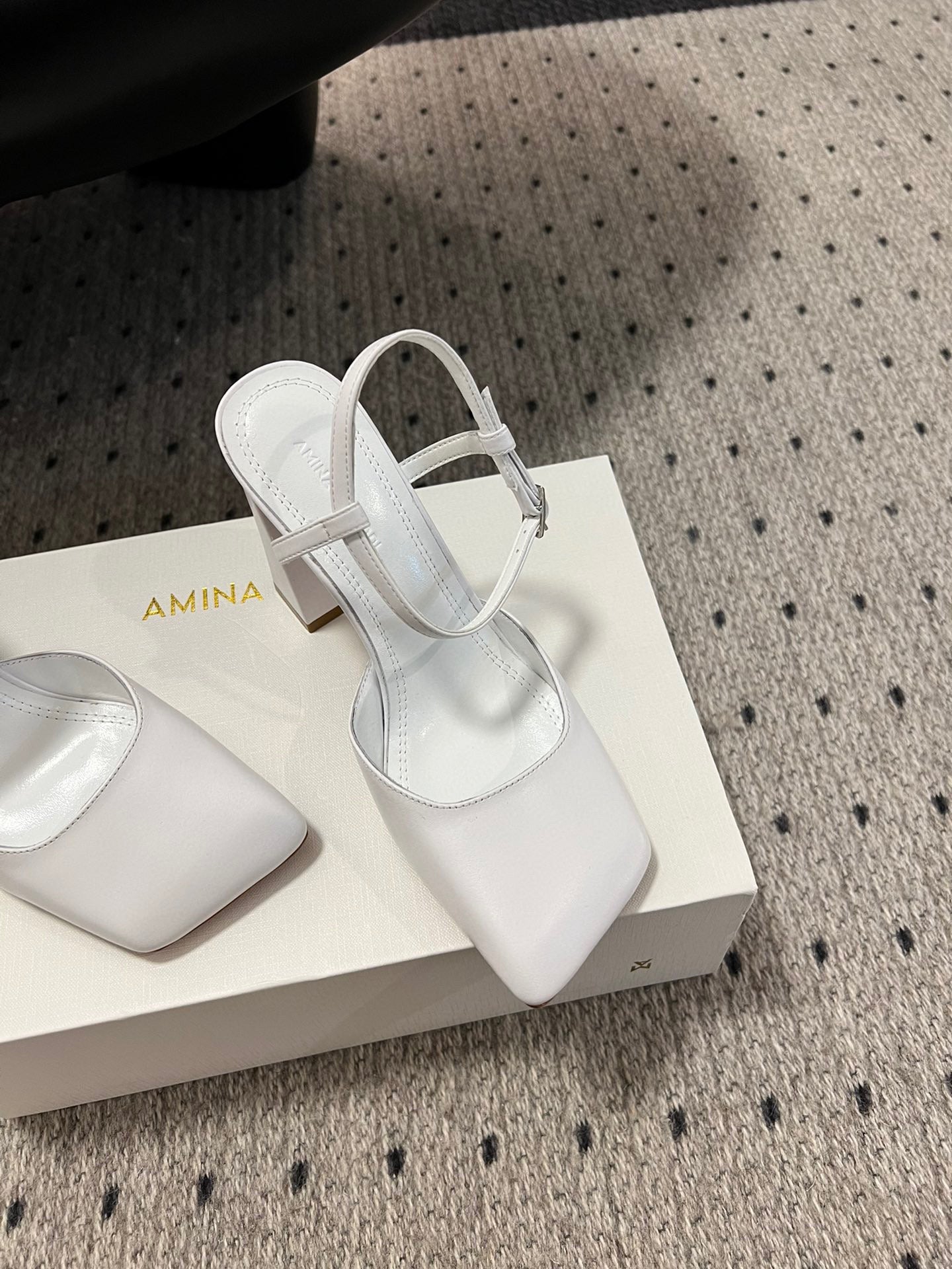 AMINA M HEELS