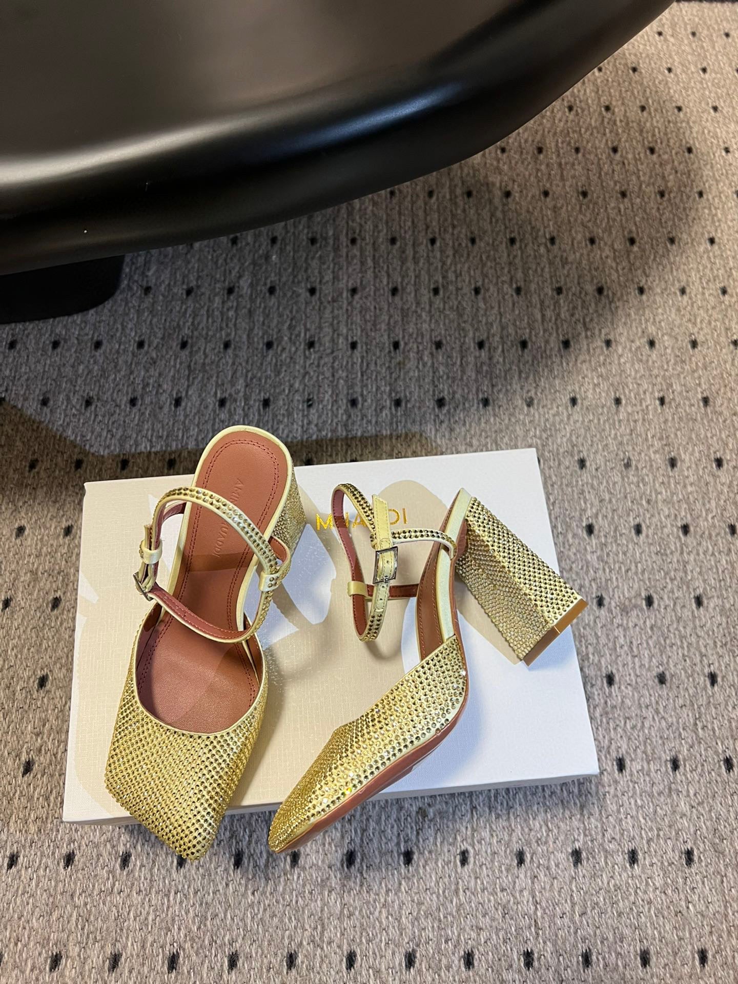 AMINA M HEELS