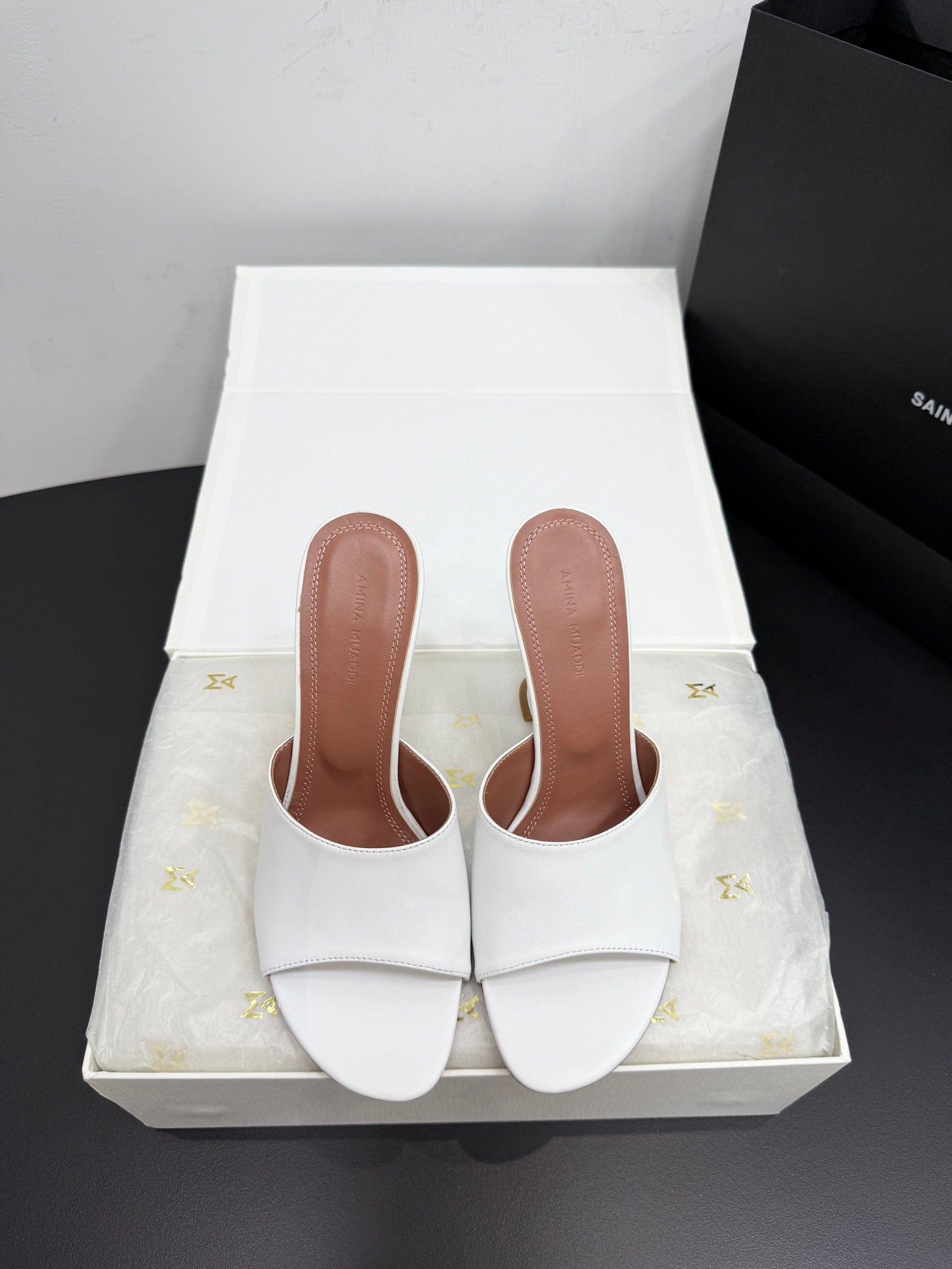 AMINA M HEELS