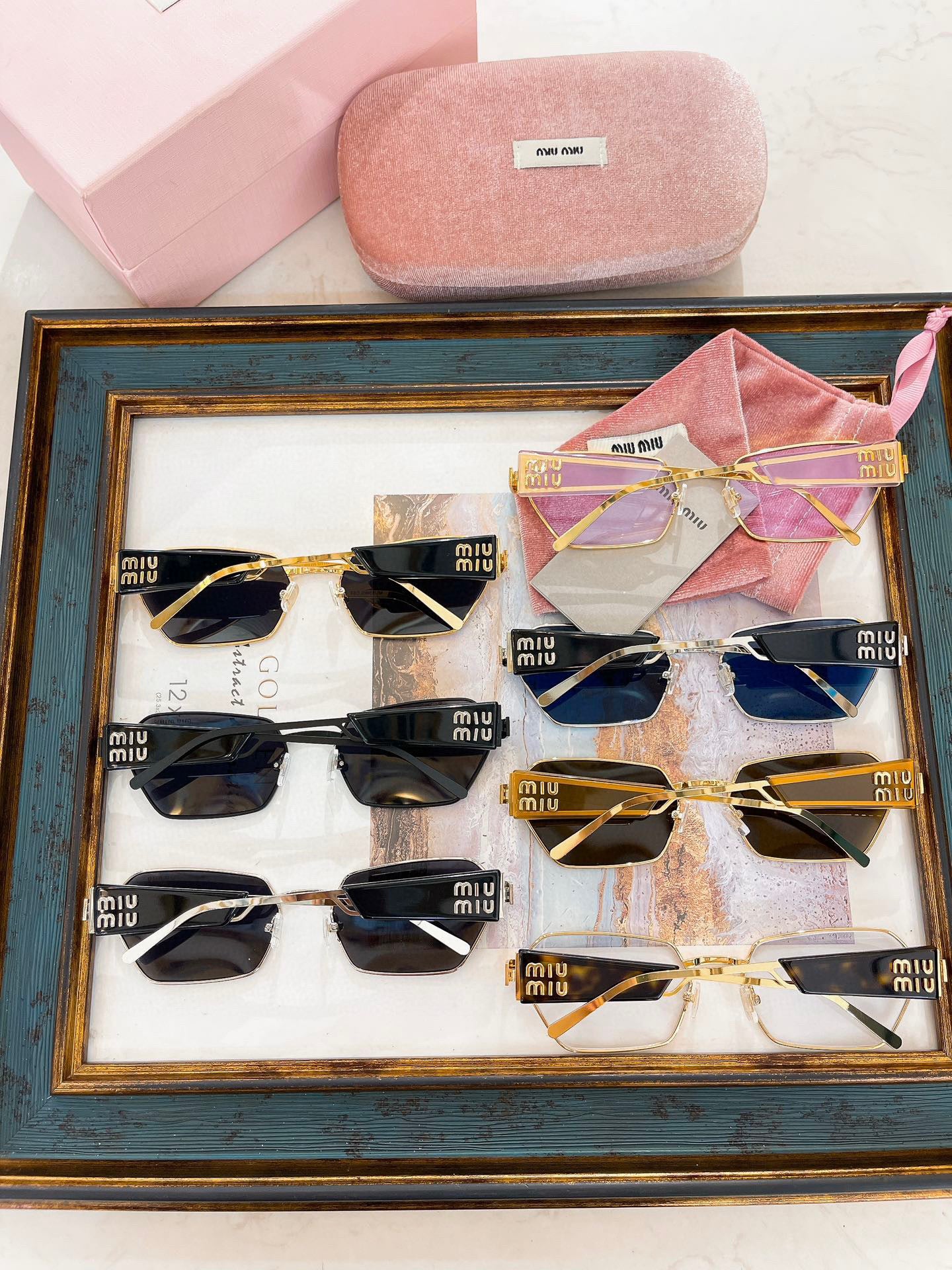 MIU M SUNGLASSES