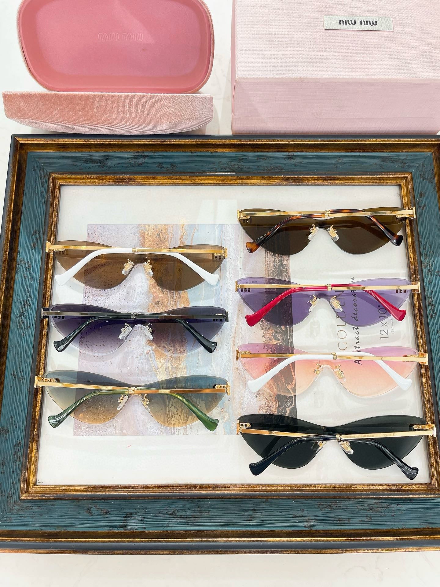 MIU M SUNGLASSES