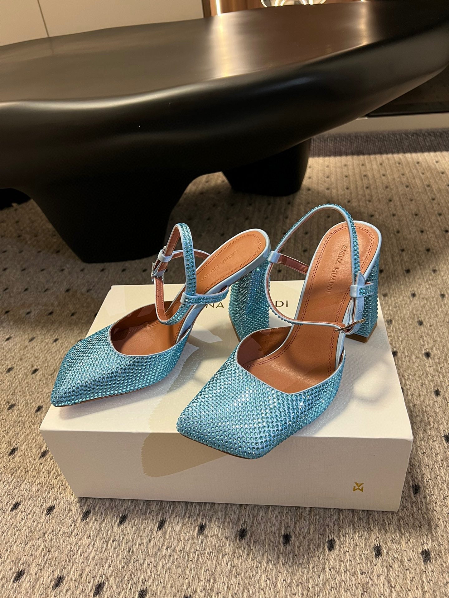AMINA M HEELS
