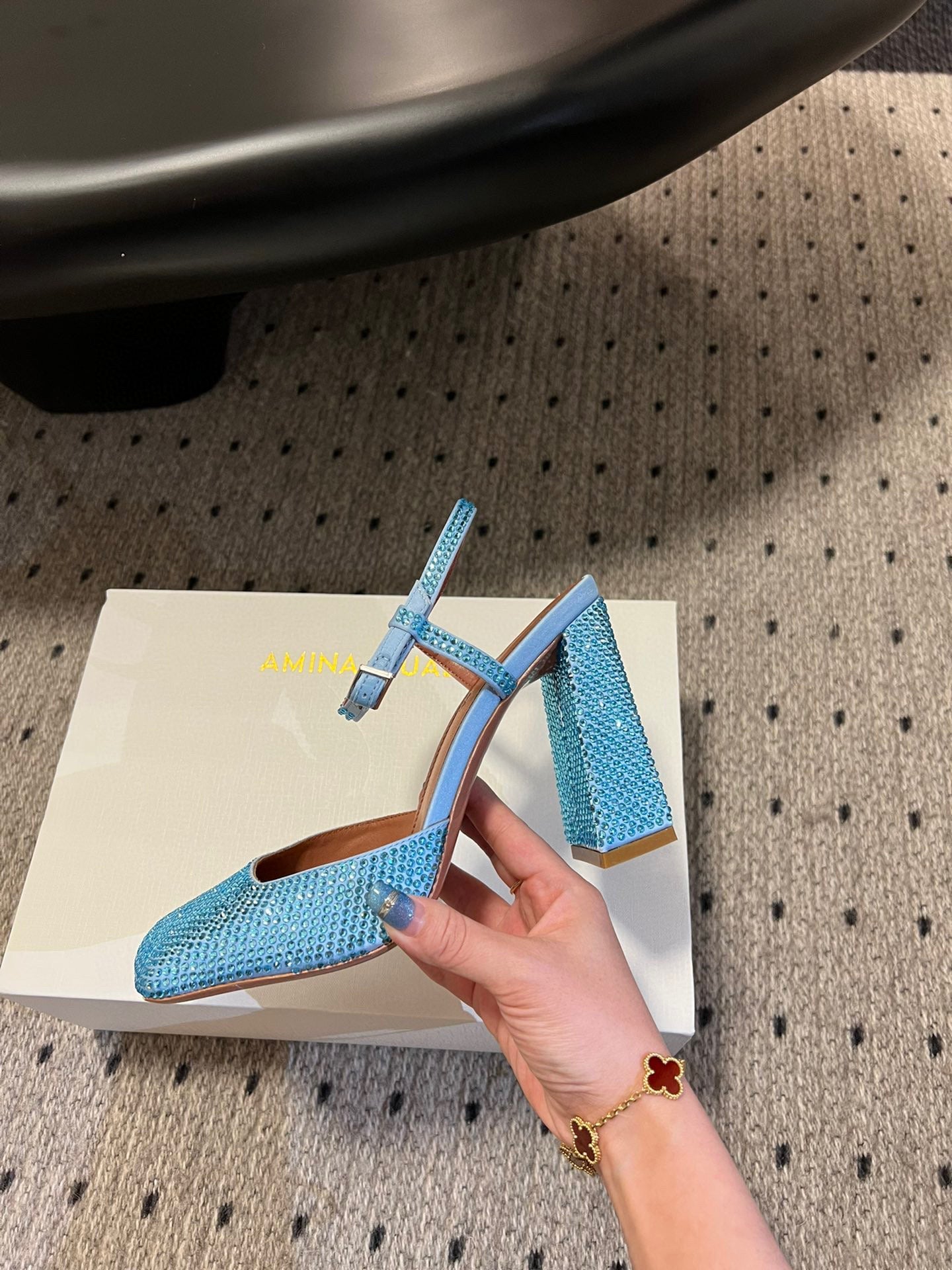 AMINA M HEELS