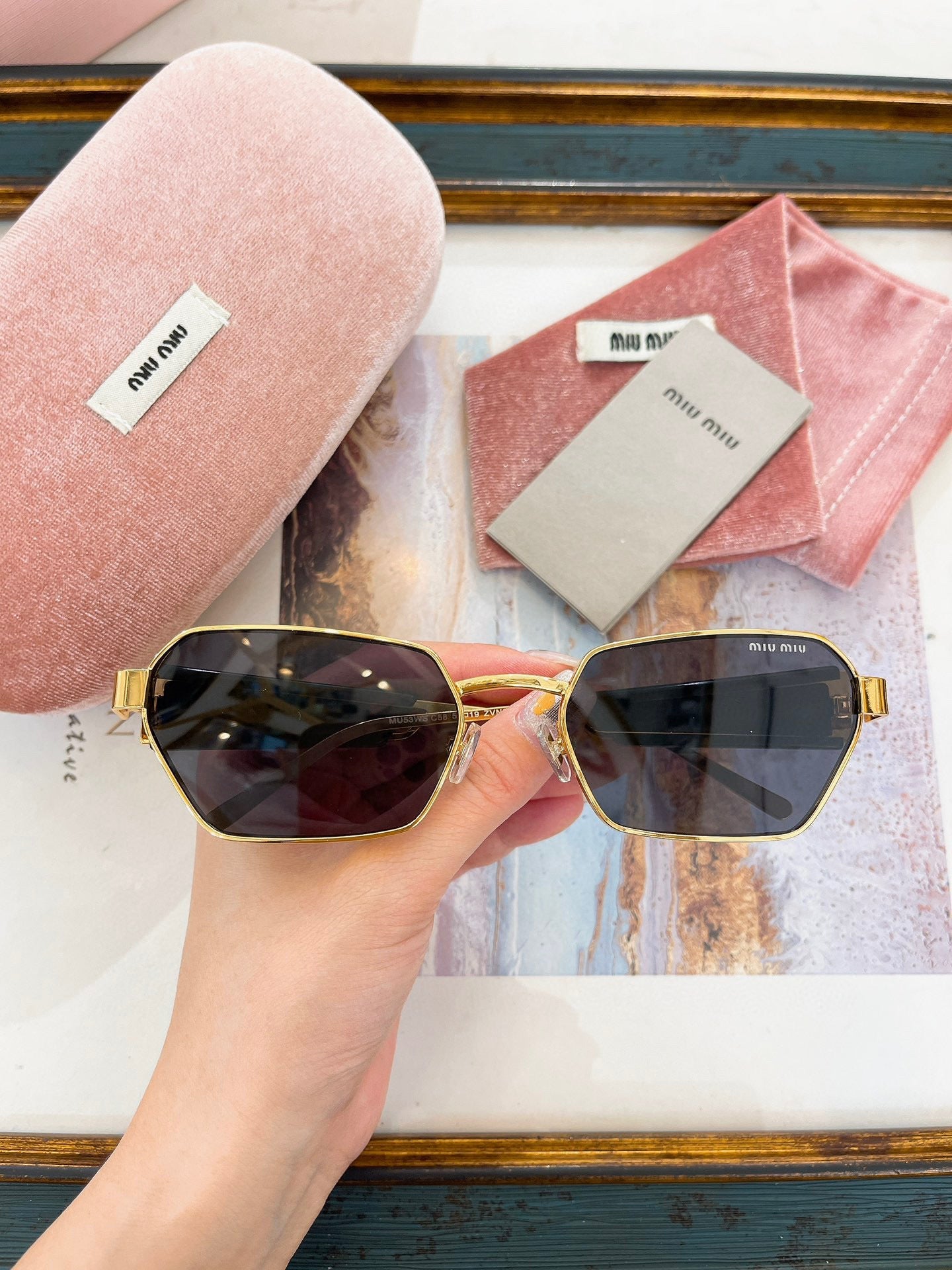 MIU M SUNGLASSES