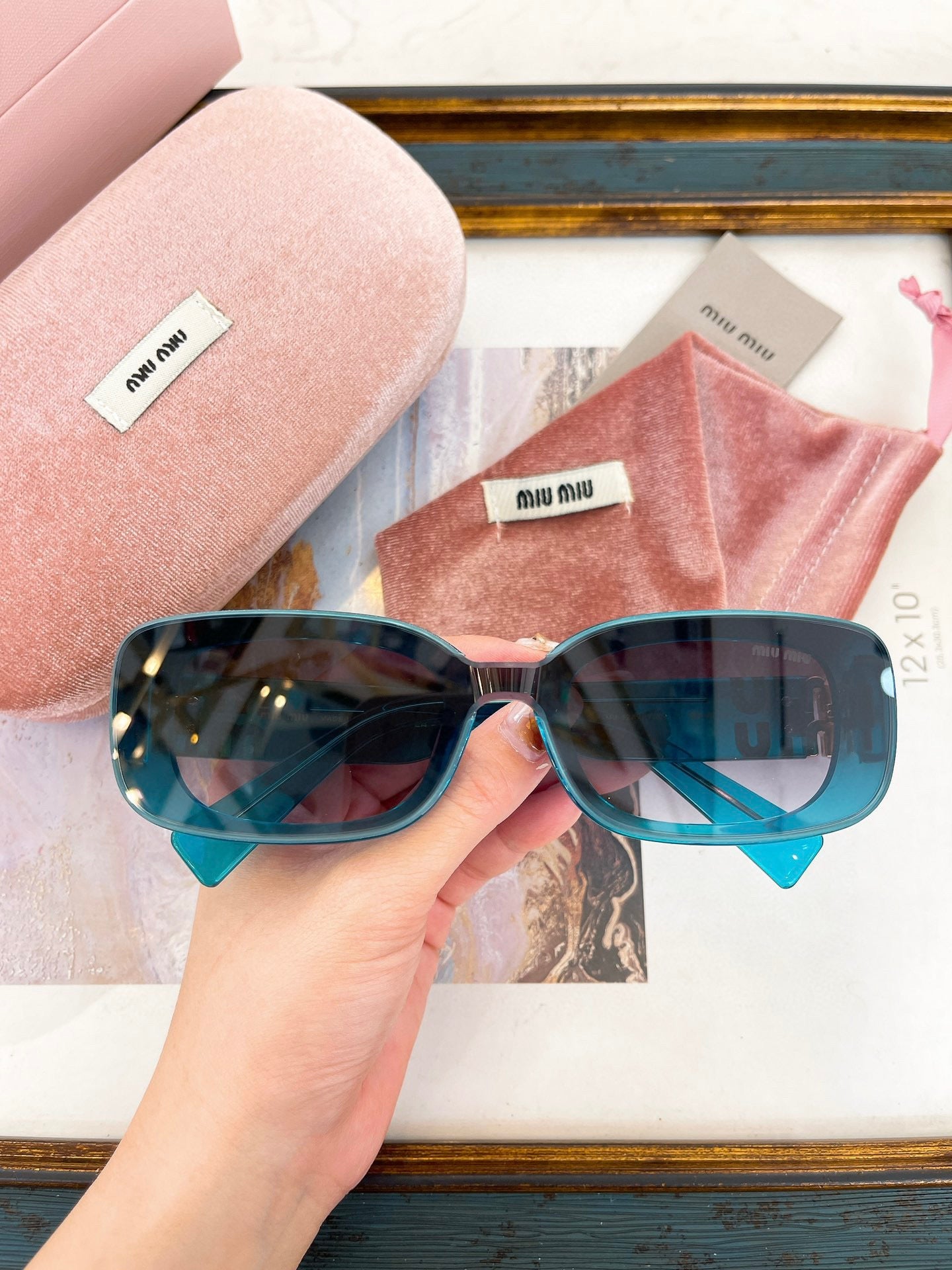 MIU M SUNGLASSES