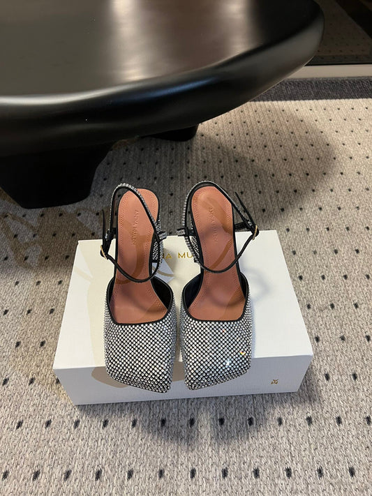 AMINA M HEELS