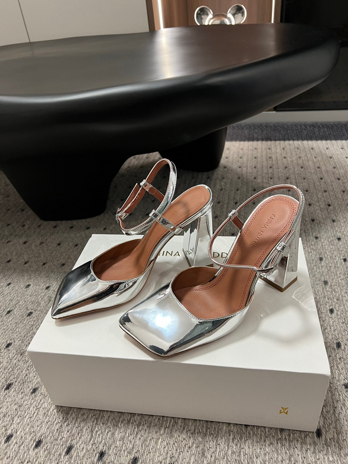 AMINA M HEELS